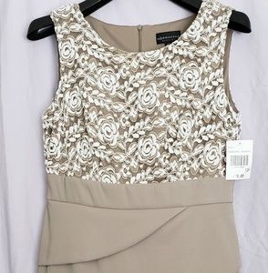 Cocktail dress with lace overlay and tiered skirt.